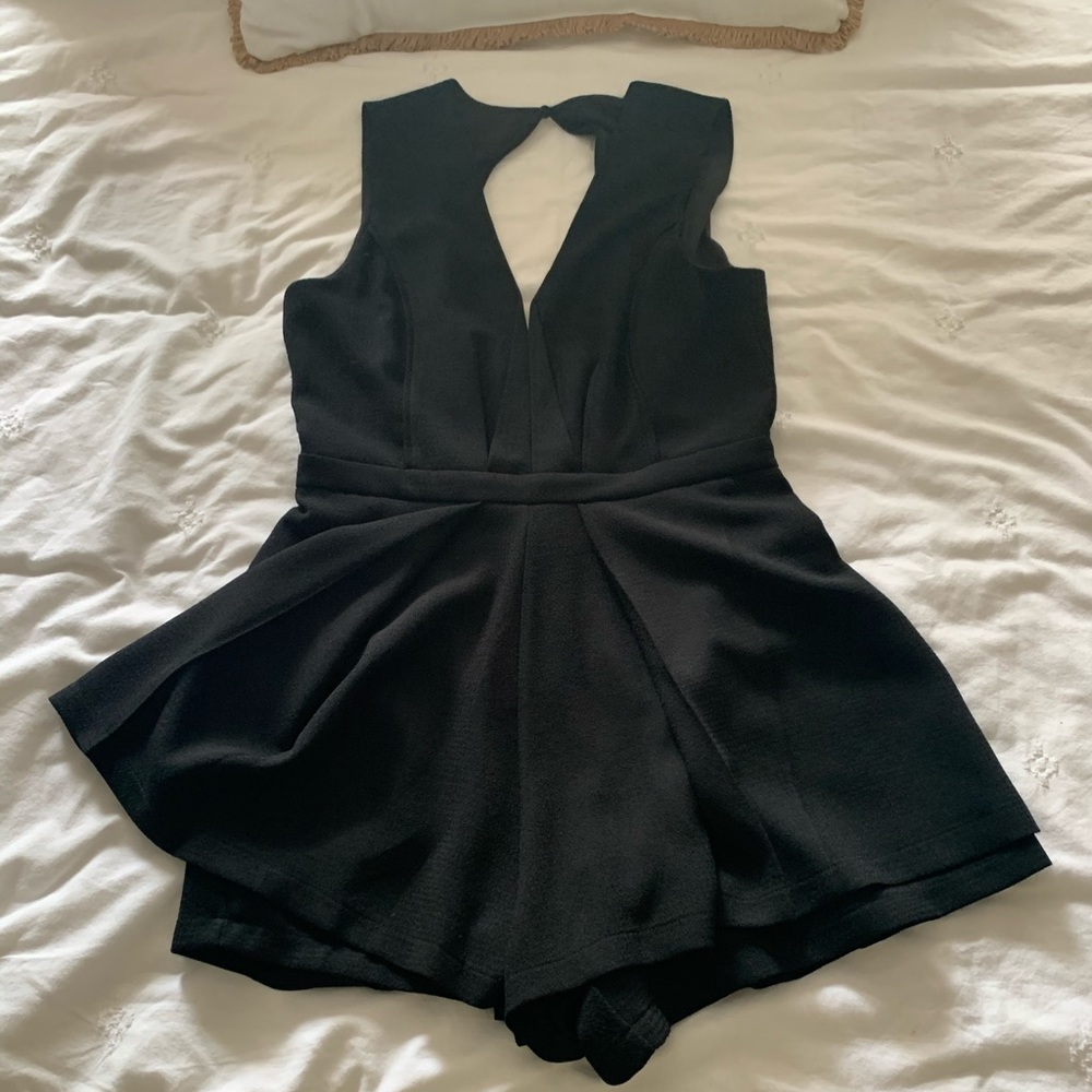 Bebe black romper size Large